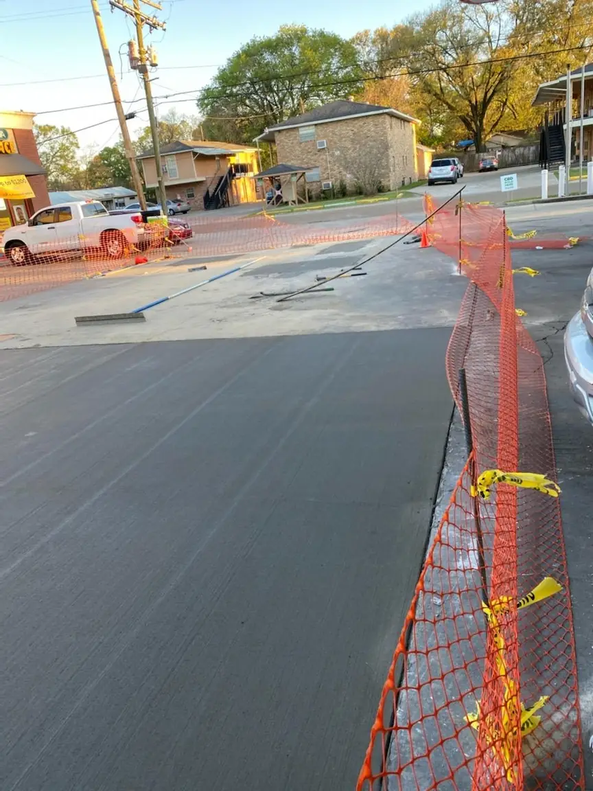 Commercial concrete surface enclosed by safety fencing